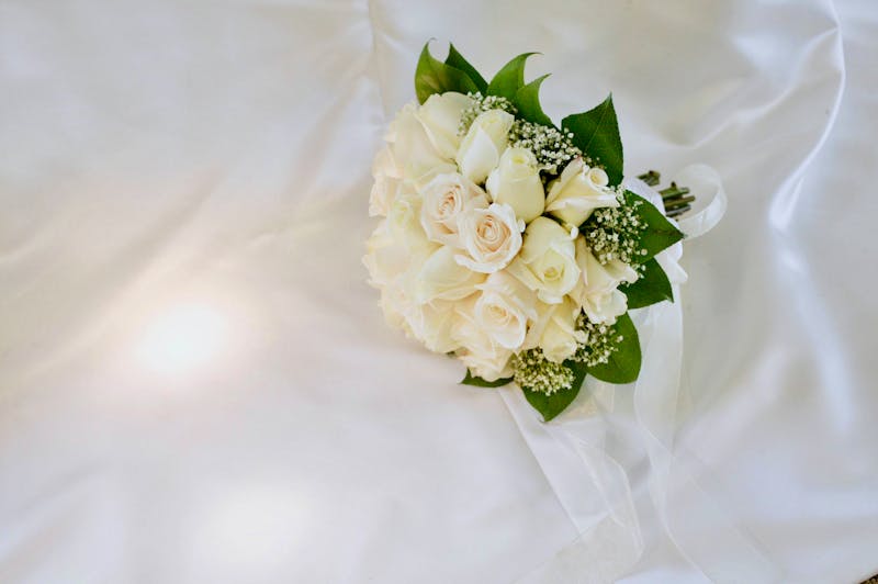Condolence flower arrangement with white roses